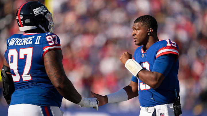 New York Giants quarterback Jameis Winston (19) cheers on New York Giants defensive tackle Dexter Lawrence II (97) during a week 9 game between New York Giants and San Francisco 49ers at MetLife Stadium on Sunday, Nov. 2, 2025.