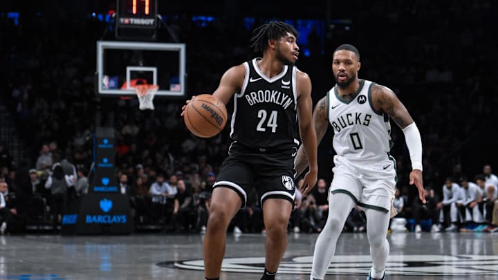 Nov 6, 2023; Brooklyn, New York, USA; Brooklyn Nets guard Cam Thomas (24) looks for an opening against Milwaukee Bucks guard Damian Lillard (0) during the first quarter at Barclays Center. Mandatory Credit: John Jones-Imagn Images