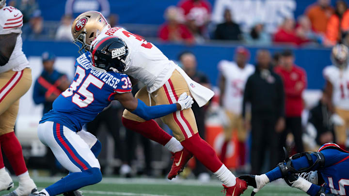 San Francisco 49ers running back Brian Robinson Jr. (3) runs with the ball before being tackled by New York Giants cornerback Jarrick Bernard-Converse (35) during a week 9 game between New York Giants and San Francisco 49ers at MetLife Stadium on Sunday, Nov. 2, 2025.