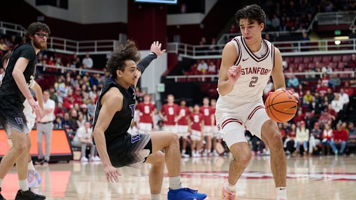 Andrej Stojakovic, then with Stanford, dribbles past the UW's Nate Calmese in 2024.