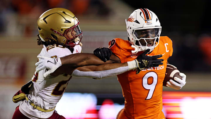 Oct 17, 2024; Blacksburg, Virginia, USA; Virginia Tech Hokies wide receiver Da'Quan Felton (9) runs the ball against Boston College Eagles defensive back KP Price (20) during the first quarter at Lane Stadium. Mandatory Credit: Peter Casey-Imagn Images Oct 17, 2024; Blacksburg, Virginia, USA; Virginia Tech Hokies wide receiver Da'Quan Felton (9) runs the ball against Boston College Eagles defensive back KP Price (20) during the first quarter at Lane Stadium. Mandatory Credit: Peter Casey-Imagn Images