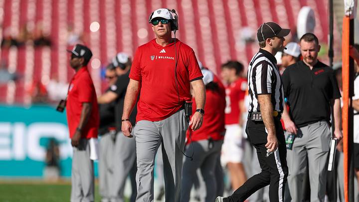 Dec 19, 2025; Tampa, FL, USA; NC State Wolfpack head coach Dave Doeren looks on against the Memphis Tigers in the first quarter during the Gasparilla Bowl at Raymond James Stadium. Mandatory Credit: Nathan Ray Seebeck-Imagn Images Dec 19, 2025; Tampa, FL, USA; NC State Wolfpack head coach Dave Doeren looks on against the Memphis Tigers in the first quarter during the Gasparilla Bowl at Raymond James Stadium. Mandatory Credit: Nathan Ray Seebeck-Imagn Images