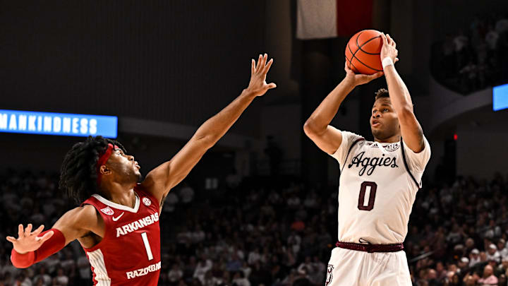 Texas A&M Aggies guard Dexter Dennis (0) shoots a three pointer over Arkansas Razorbacks guard Ricky Council IV (1) during the second half at Reed Arena.