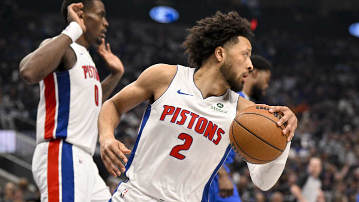 Mar 21, 2025; Dallas, Texas, USA; Detroit Pistons guard Cade Cunningham (2) grabs a rebound against the Dallas Mavericks during the first quarter at the American Airlines Center. Mandatory Credit: Jerome Miron-Imagn Images