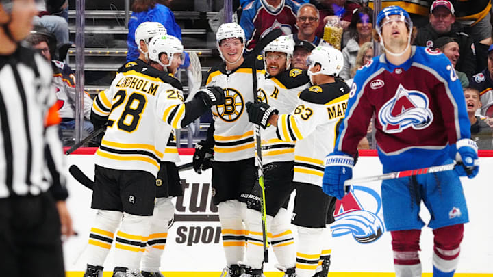 Oct 16, 2024; Denver, Colorado, USA; Boston Bruins right wing David Pastrnak (88) celebrates his goal with center Elias Lindholm (28), left wing Brad Marchand (63), and center Trent Frederic (11) in the second period against the Colorado Avalanche at Ball Arena. Mandatory Credit: Ron Chenoy-Imagn Images Oct 16, 2024; Denver, Colorado, USA; Boston Bruins right wing David Pastrnak (88) celebrates his goal with center Elias Lindholm (28), left wing Brad Marchand (63), and center Trent Frederic (11) in the second period against the Colorado Avalanche at Ball Arena. Mandatory Credit: Ron Chenoy-Imagn Images