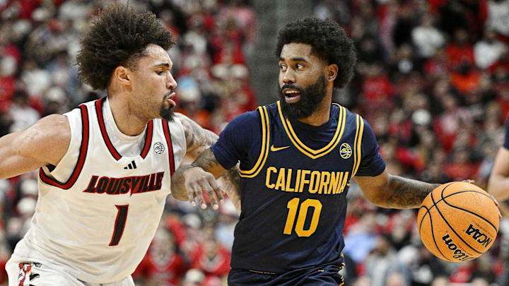 Mar 5, 2025; Louisville, Kentucky, USA;  California Golden Bears guard Jovan Blacksher Jr. (10) dribbles against Louisville Cardinals guard J'Vonne Hadley (1) during the first half at KFC Yum! Center. Mandatory Credit: Jamie Rhodes-Imagn Images