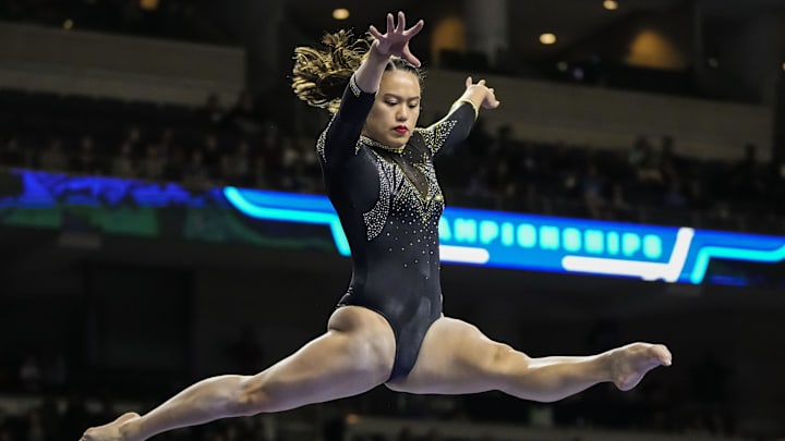 Mar 18, 2023; Duluth, GA, USA; Missouri Tigers gymnast Helen Hu competes on the  balance beam during the SEC Gymnastics Championship at Gas South Arena. Mandatory Credit: Dale Zanine-Imagn Images