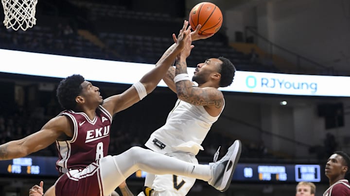 Nov 12, 2025; Nashville, Tennessee, USA;  Vanderbilt Commodores guard Frankie Collins (1) shoots over  Eastern Kentucky Colonels forward Jalen Cooper (8) during the second half at Memorial Gymnasium. Mandatory Credit: Steve Roberts-Imagn Images
