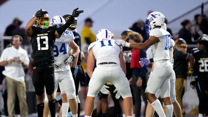 Moeller Crusaders wide receiver Jovan Love (13) signals for a first down after a catch and run in the first half of a high school football game between the St. Xavier Bombers and the Moeller Crusaders, Friday, Sept. 15, 2023, at Welcome Stadium in Dayton, Ohio.