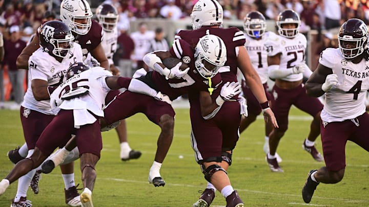 Oct 19, 2024; Starkville, Mississippi, USA; Mississippi State Bulldogs wide receiver Mario Craver (7) runs the ball against Texas A&M Aggies defensive back Dalton Brooks (25) on a play that would result in an apparent injury to Craver during the third quarter at Davis Wade Stadium at Scott Field. Mandatory Credit: Matt Bush-Imagn Images