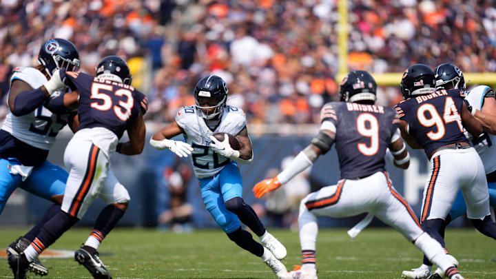 Tennessee Titans running back Tony Pollard (20) runs through the Chicago Bears defense on his way to a touchdown at Soldier Field in Chicago, Ill., Sunday, Sept. 8, 2024.
