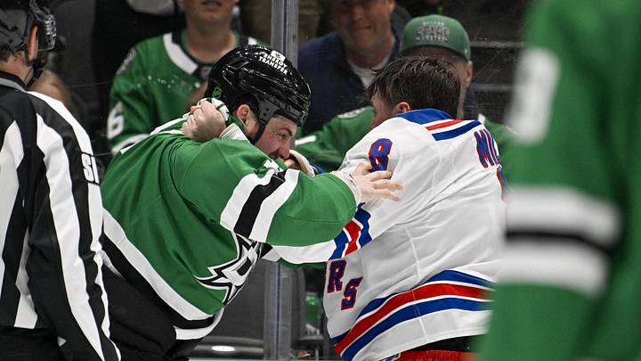 Apr 11, 2026; Dallas, Texas, USA; New York Rangers left wing J.T. Miller (8) fights with Dallas Stars left wing Jamie Benn (14) during the second period at the American Airlines Center. Mandatory Credit: Jerome Miron-Imagn Images