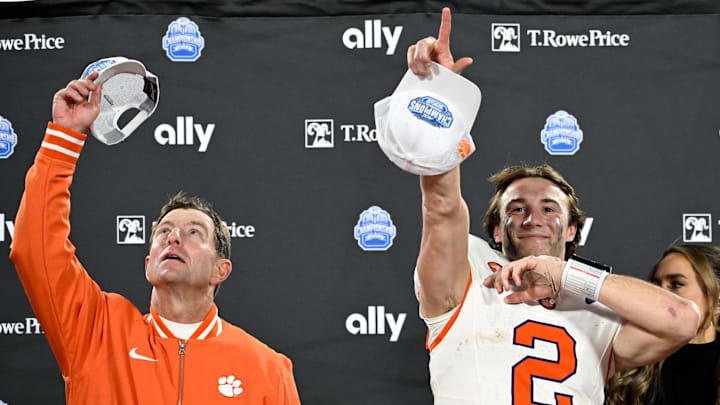 Dec 7, 2024; Charlotte, NC, USA; Clemson Tigers head coach Dabo Swinney, and quarterback Cade Klubnik (2) celebrate after winning the 2024 ACC Championship game against the Southern Methodist Mustangs at Bank of America Stadium.