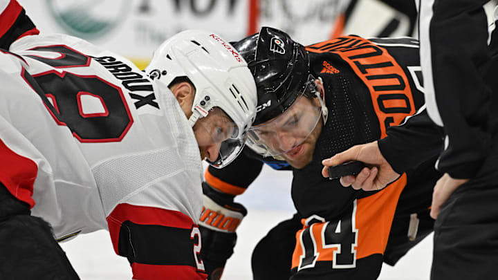 Jan 21, 2024; Philadelphia, Pennsylvania, USA; Ottawa Senators right wing Claude Giroux (28) and Philadelphia Flyers center Sean Couturier (14) face off during the first period at Wells Fargo Center.