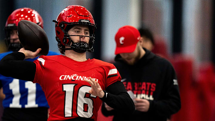 Cincinnati Bearcats quarterback Brady Lichtenberg (16) throws a pass during football practice at Sheakley Athletic Performance Center in Cincinnati on Dec. 18, 2025.