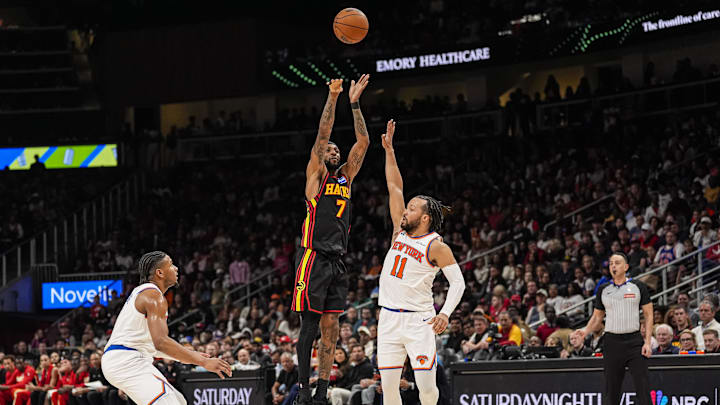 Apr 6, 2026; Atlanta, Georgia, USA; Atlanta Hawks guard Nickeil Alexander-Walker (7) shoots over New York Knicks guard Jalen Brunson (11) during the second half at State Farm Arena. Mandatory Credit: Dale Zanine-Imagn Images