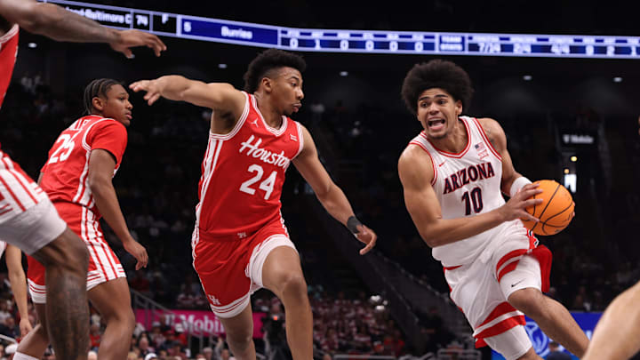 Mar 14, 2026; Kansas City, MO, USA; Arizona Wildcats forward Koa Peat (10) drives to the hoop past Houston Cougars forward Chase McCarty (24) during the first half during the men's Big 12 Conference Tournament Championship at T-Mobile Center. Mandatory Credit: William Purnell-Imagn Images Mar 14, 2026; Kansas City, MO, USA; Arizona Wildcats forward Koa Peat (10) drives to the hoop past Houston Cougars forward Chase McCarty (24) during the first half during the men's Big 12 Conference Tournament Championship at T-Mobile Center. Mandatory Credit: William Purnell-Imagn Images