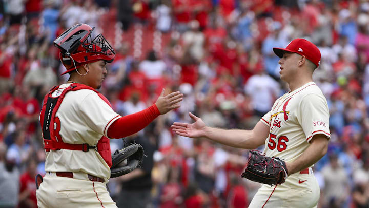 May 24, 2025; St. Louis, Missouri, USA;  St. Louis Cardinals relief pitcher Ryan Helsley (56) celebrates with catcher Yohel Pozo (63) after the Cardinals defeated the Arizona Diamondbacks at Busch Stadium. Mandatory Credit: Jeff Curry-Imagn Images