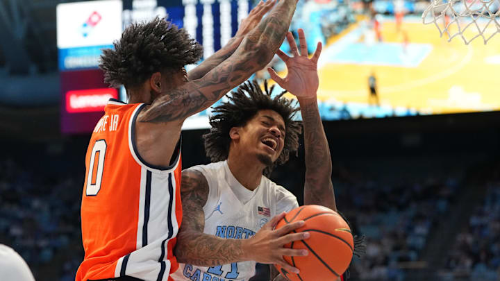 Feb 2, 2026; Chapel Hill, North Carolina, USA; North Carolina Tar Heels forward Jonathan Powell (11) shoots as Syracuse Orange forward Sadiq White Jr. (0) and forward Donnie Freeman (1) defend in the second half at Dean E. Smith Center. Mandatory Credit: Bob Donnan-Imagn Images Feb 2, 2026; Chapel Hill, North Carolina, USA; North Carolina Tar Heels forward Jonathan Powell (11) shoots as Syracuse Orange forward Sadiq White Jr. (0) and forward Donnie Freeman (1) defend in the second half at Dean E. Smith Center. Mandatory Credit: Bob Donnan-Imagn Images