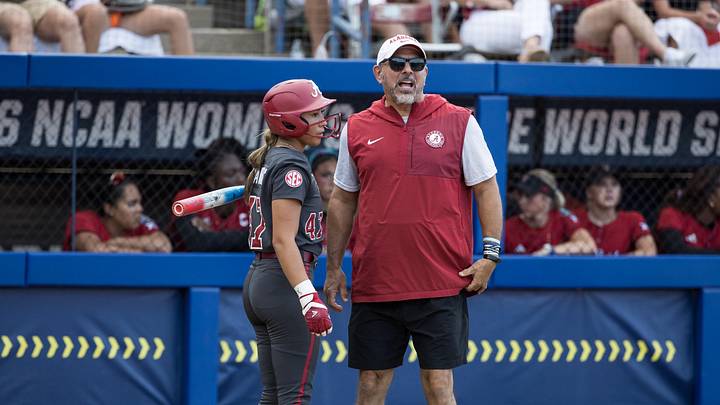 Jun 1, 2026; Oklahoma City, OK, USA; Alabama Crimson Tide head coach Patrick Murphy talks with infielder Salen Hawkins (47) in the fourth inning against the Texas Tech Red Raiders during the NCAA Women’s College World Series at Devon Park. Mandatory Credit: Brett Rojo-Imagn Images Jun 1, 2026; Oklahoma City, OK, USA; Alabama Crimson Tide head coach Patrick Murphy talks with infielder Salen Hawkins (47) in the fourth inning against the Texas Tech Red Raiders during the NCAA Women’s College World Series at Devon Park. Mandatory Credit: Brett Rojo-Imagn Images