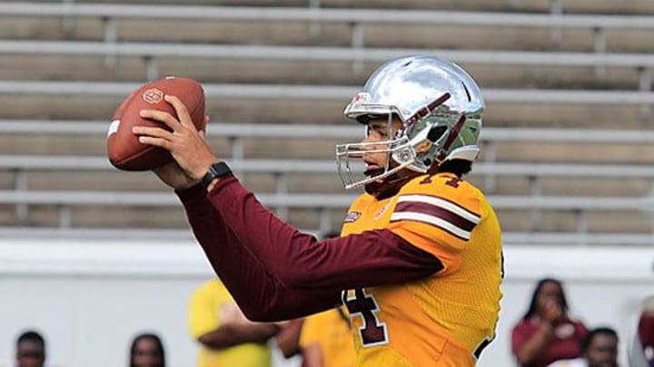 Bethune-Cookman QB Dominiq Ponder takes a snap during the Wildcats' spring game Saturday, April 22, 2023, at Daytona Stadium