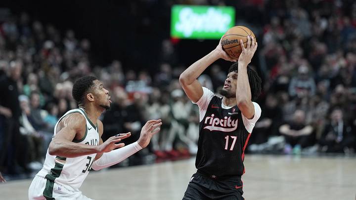 Jan 28, 2025; Portland, Oregon, USA; Portland Trail Blazers shooting guard Shaedon Sharpe (17) shoots the ball over Milwaukee Bucks power forward Giannis Antetokounmpo (34) during the first half at Moda Center. Mandatory Credit: Soobum Im-Imagn Images Jan 28, 2025; Portland, Oregon, USA; Portland Trail Blazers shooting guard Shaedon Sharpe (17) shoots the ball over Milwaukee Bucks power forward Giannis Antetokounmpo (34) during the first half at Moda Center. Mandatory Credit: Soobum Im-Imagn Images