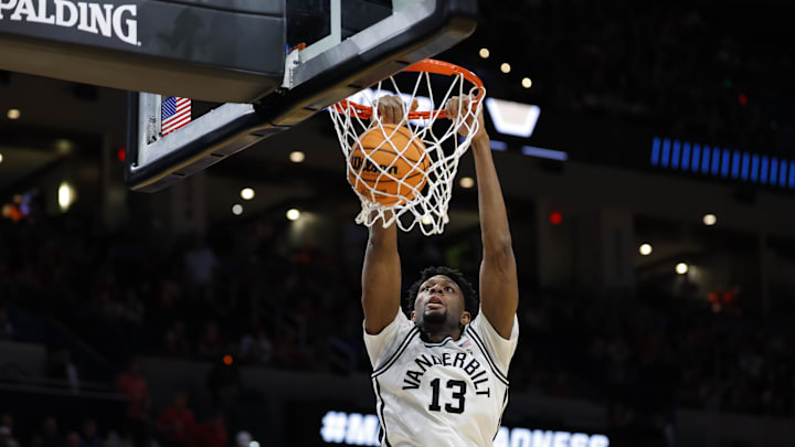 Mar 19, 2026; Oklahoma City, OK, USA; Vanderbilt Commodores forward Jalen Washington (13) dunks during the first half against the McNeese Cowboys during a first round game of the men's 2026 NCAA Tournament at Paycom Center.