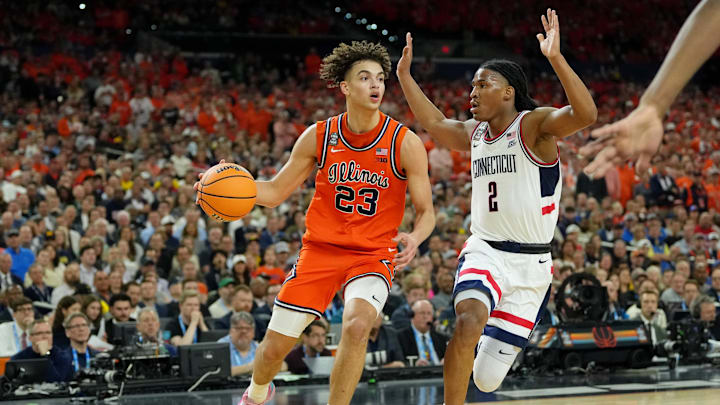 Apr 4, 2026; Indianapolis, IN, USA; Illinois Fighting Illini guard Keaton Wagler (23) dribbles the ball against UConn Huskies guard Silas Demary Jr. (2) during the first half of a semifinal of the Final Four of the men's 2026 NCAA Tournament at Lucas Oil Stadium. Mandatory Credit: Bob Donnan-Imagn Images