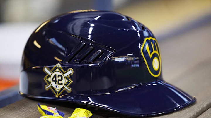 Apr 15, 2022; Milwaukee, Wisconsin, USA;  A Milwaukee Brewers batting helmet sits in the dugout showing the Jackie Robinson Number 42 prior to the game against the St. Louis Cardinals at American Family Field. Mandatory Credit: Jeff Hanisch-Imagn Images