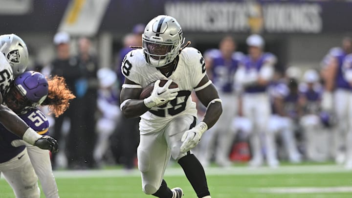 Aug 10, 2024; Minneapolis, Minnesota, USA; Las Vegas Raiders running back Sincere McCormick (28) runs the ball against the Minnesota Vikings during the third quarter at U.S. Bank Stadium. Mandatory Credit: Jeffrey Becker-Imagn Images
