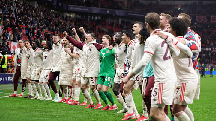 Bayern Munich players celebrating after defeating Bayer Leverkusen in the Champions League.