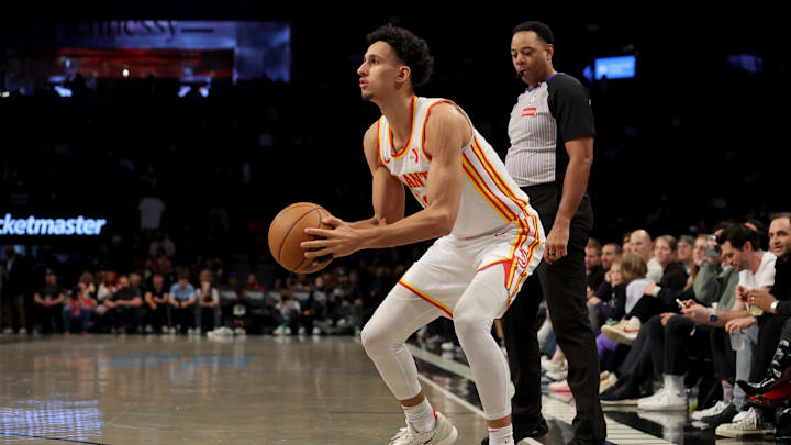 Apr 10, 2025; Brooklyn, New York, USA; Atlanta Hawks forward Zaccharie Risacher (10) sets for a three point shot against the Brooklyn Nets during the fourth quarter at Barclays Center. Mandatory Credit: Brad Penner-Imagn Images