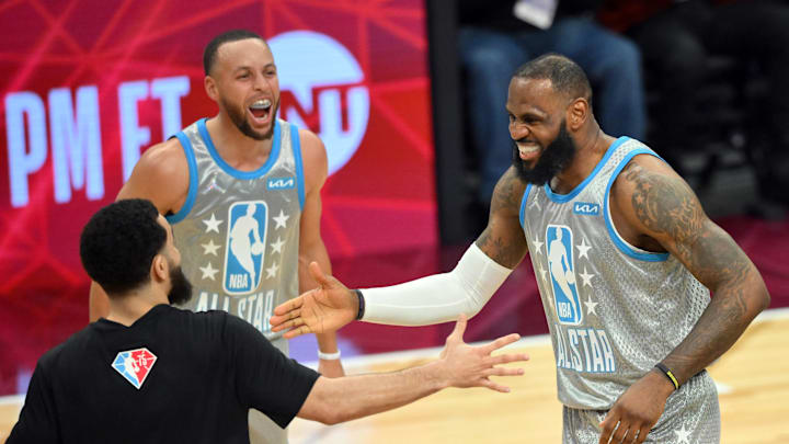 Feb 20, 2022; Cleveland, Ohio, USA; Team LeBron forward LeBron James celebrates after making the game winning shot with Team LeBron guard Stephen Curry (30) and Team LeBron guard Fred VanVleet (23) during the 2022 NBA All-Star Game at Rocket Mortgage FieldHouse. Mandatory Credit: David Richard-Imagn Images