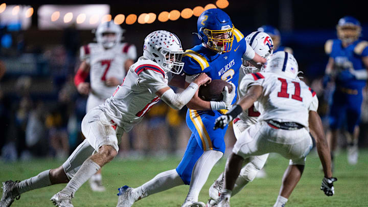 DCA's Carson Sneed (2) runs after a catch with Tipton-Rosemark's Tanner Thornell (12) trying to tackle him during their Division II-A playoff game at Donelson Christian Academy in Nashville, Tenn., Friday, Nov. 8, 2024.