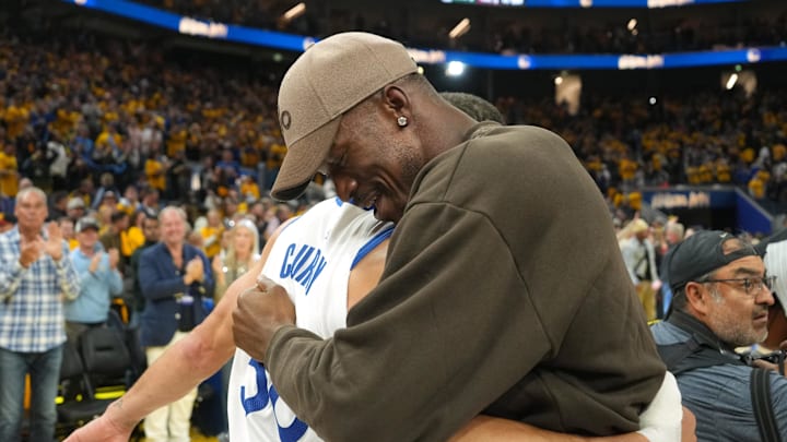 Apr 26, 2025; San Francisco, California, USA; Golden State Warriors guard Stephen Curry (left) and forward Jimmy Butler III (right) hug after defeating the Houston Rockets during game three of first round for the 2024 NBA Playoffs at Chase Center. Mandatory Credit: Darren Yamashita-Imagn Images