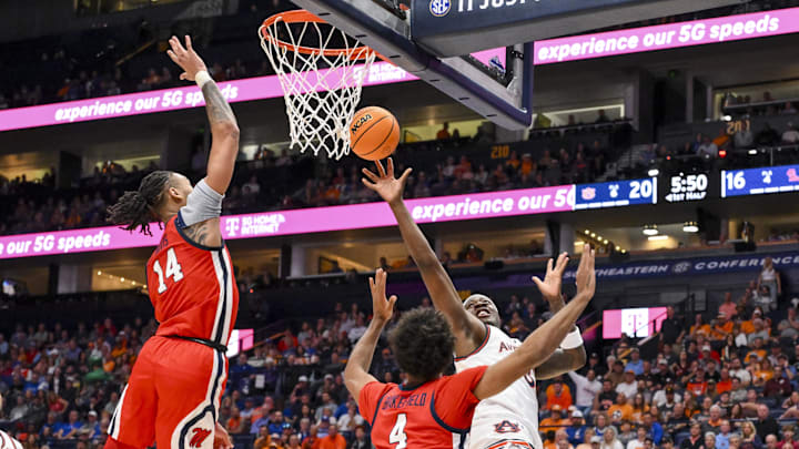 Mar 14, 2025; Nashville, TN, USA; Mississippi Rebels guard Dre Davis (14) blocks the shot of Auburn Tigers guard Tahaad Pettiford (0) during the first half at Bridgestone Arena. Mandatory Credit: Steve Roberts-Imagn Images Mar 14, 2025; Nashville, TN, USA; Mississippi Rebels guard Dre Davis (14) blocks the shot of Auburn Tigers guard Tahaad Pettiford (0) during the first half at Bridgestone Arena. Mandatory Credit: Steve Roberts-Imagn Images