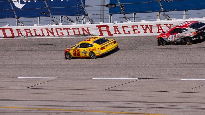 Mar 22, 2026; Darlington, South Carolina, USA; Team Penske Joey Logano (22) and Haas Factory Team Cole Custer (41) drive in the Goodyear 400 at Darlington Raceway. Mar 22, 2026; Darlington, South Carolina, USA; Team Penske Joey Logano (22) and Haas Factory Team Cole Custer (41) drive in the Goodyear 400 at Darlington Raceway.