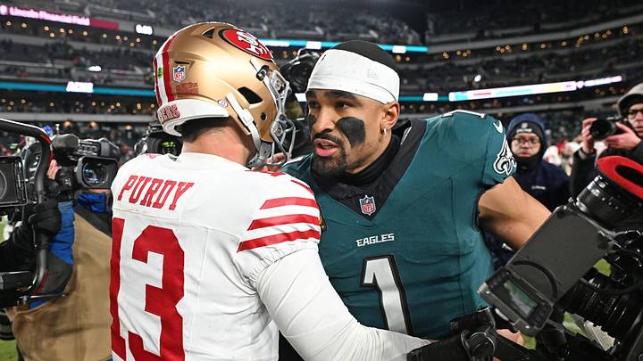 Jan 11, 2026; Philadelphia, PA, USA; San Francisco 49ers quarterback Brock Purdy (13) and Philadelphia Eagles quarterback Jalen Hurts (1) meet on the field in an NFC Wild Card Round game at Lincoln Financial Field. Mandatory Credit: Eric Hartline-Imagn Images