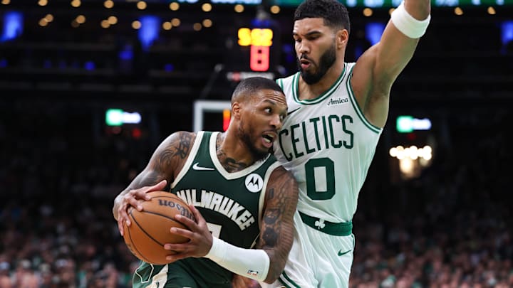 Oct 28, 2024; Boston, Massachusetts, USA; Milwaukee Bucks guard Damian Lillard (0) drives to the basket defended by Boston Celtics forward Jayson Tatum (0) during the first half at TD Garden. Mandatory Credit: Paul Rutherford-Imagn Images