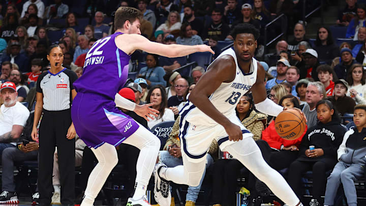 Jan 25, 2025; Memphis, Tennessee, USA; Memphis Grizzlies forward Jaren Jackson Jr. (13) drives to the basket against Utah Jazz forward Kyle Filipowski (22) during the second quarter at FedExForum. Mandatory Credit: Petre Thomas-Imagn Images