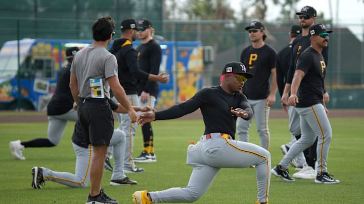 Pittsburgh Pirates players get warmed up with calisthenics before starting drills during spring training on Wednesday, Feb. 19, 2025 at Pirate City in Bradenton, Florida.