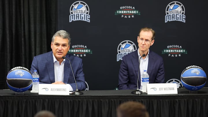 Apr 11, 2023; Orlando, Florida, USA;  Orlando Magic CEO Alex Martins and  president of basketball operations Jeff Weltman speak during a press conference for the new Orlando Magic G-League stadium at Osceola Heritage Park. Mandatory Credit: Nathan Ray Seebeck-Imagn Images
