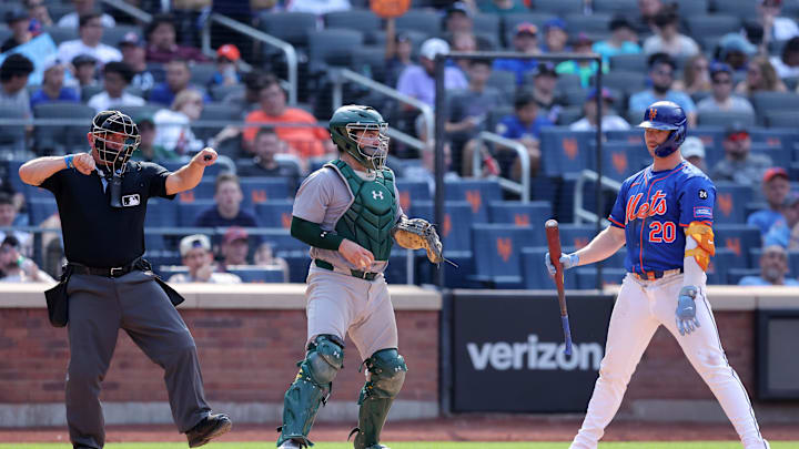 Aug 15, 2024; New York City, New York, USA; New York Mets first baseman Pete Alonso (20) reacts after being called out on strikes by home plate umpire Scott Barry (87) during the seventh inning against the Oakland Athletics at Citi Field. Mandatory Credit: Brad Penner-USA TODAY Sports