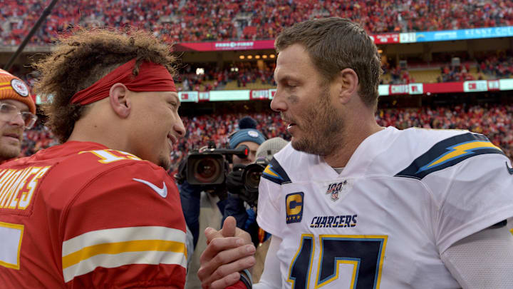 Dec 29, 2019; Kansas City, Missouri, USA; Kansas City Chiefs quarterback Patrick Mahomes (15) and Los Angeles Chargers quarterback Philip Rivers (17) shake hands after the game at Arrowhead Stadium. Mandatory Credit: Denny Medley-Imagn Images