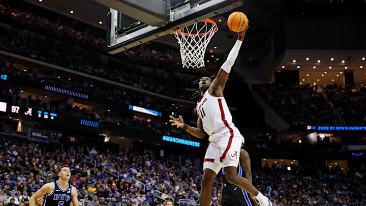 Mar 27, 2025; Newark, NJ, USA; Alabama Crimson Tide center Clifford Omoruyi (11) dunks the ball against Brigham Young Cougars forward Mawot Mag (0) during the second half during an East Regional semifinal of the 2025 NCAA tournament at Prudential Center. Mandatory Credit: Vincent Carchietta-Imagn Images