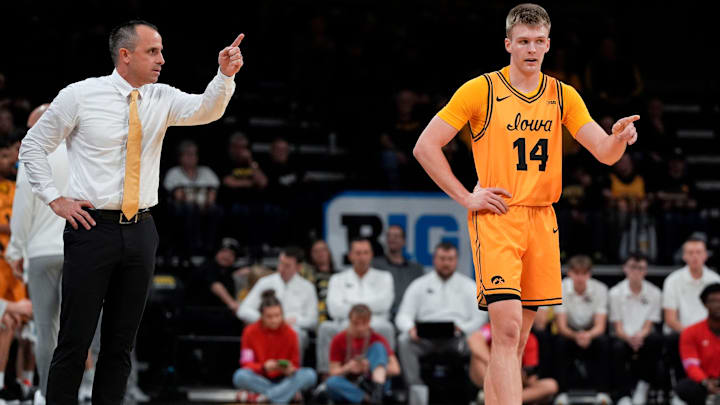 Iowa head coach Ben McCollum talks to Iowa guard Bennett Stirtz (14) during a basketball game against the Southeast Missouri Red Hawks Nov. 18, 2025 at Carver-Hawkeye Arena in Iowa City, Iowa.