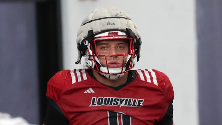 Louisville’s Ashton Gillotte warms up for Spring Practice on Thursday.
April 4, 2024