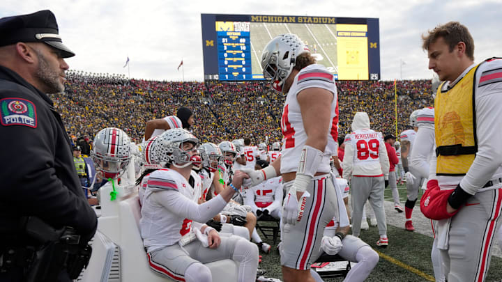 Nov. 25, 2023; Ann Arbor, Mi., USA;
Ohio State Buckeyes quarterback Kyle McCord (6) is consoled by teammate Ohio State Buckeyes tight end Joe Royer (84) on the bench near the end of a 30-24 loss to the Michigan Wolverines in Saturday  s NCAA Division I football game at Michigan Stadium.