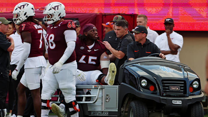 Sep 21, 2024; Blacksburg, Virginia, USA; Virginia Tech Hokies offensive lineman Xavier Chaplin (65) is carted off the field after an injury during the fourth quarter against the Rutgers Scarlet Knights at Lane Stadium. Mandatory Credit: Peter Casey-Imagn Images Sep 21, 2024; Blacksburg, Virginia, USA; Virginia Tech Hokies offensive lineman Xavier Chaplin (65) is carted off the field after an injury during the fourth quarter against the Rutgers Scarlet Knights at Lane Stadium. Mandatory Credit: Peter Casey-Imagn Images