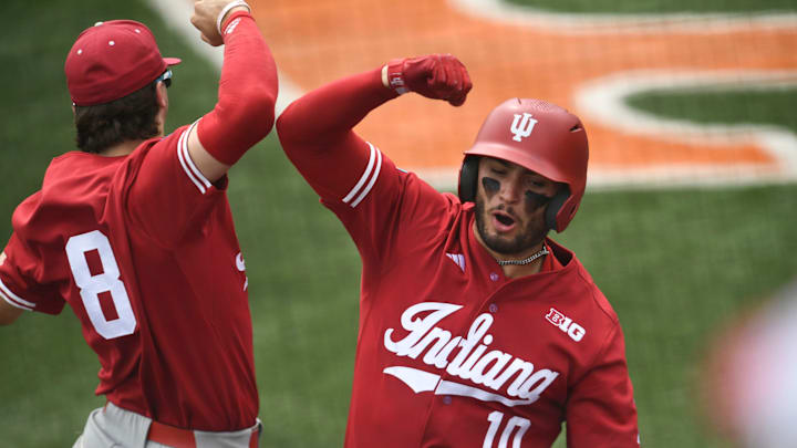 Indiana's Morgan Colopy (10) and Tyler Cerny (8) celebrate Colopy's home run against Southern Miss in the NCAA Baseball Tournament Knoxville Regional at Lindsey Nelson Stadium on Friday, May 31, 2024 in Knoxville, Tenn.